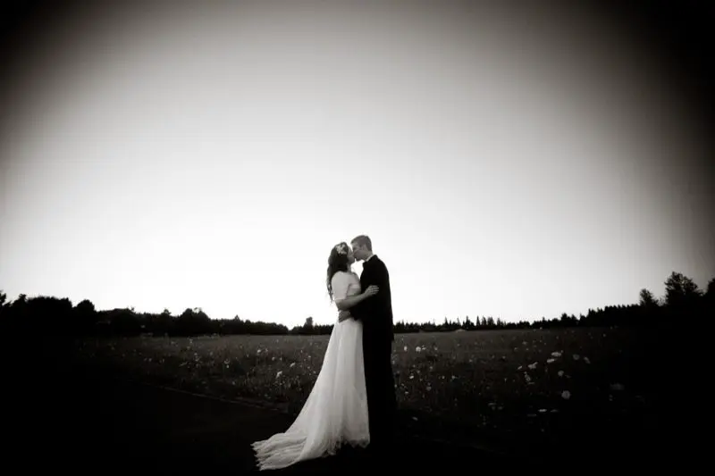 wedding and groom in a field backyard wedding bride and groom in open field