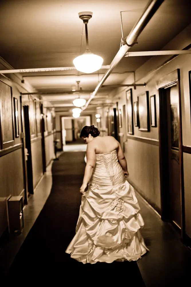 bride walking down hallway of hotel bride on the way to first look