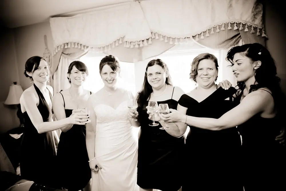 bride's room bride with bridesmaids while getting ready