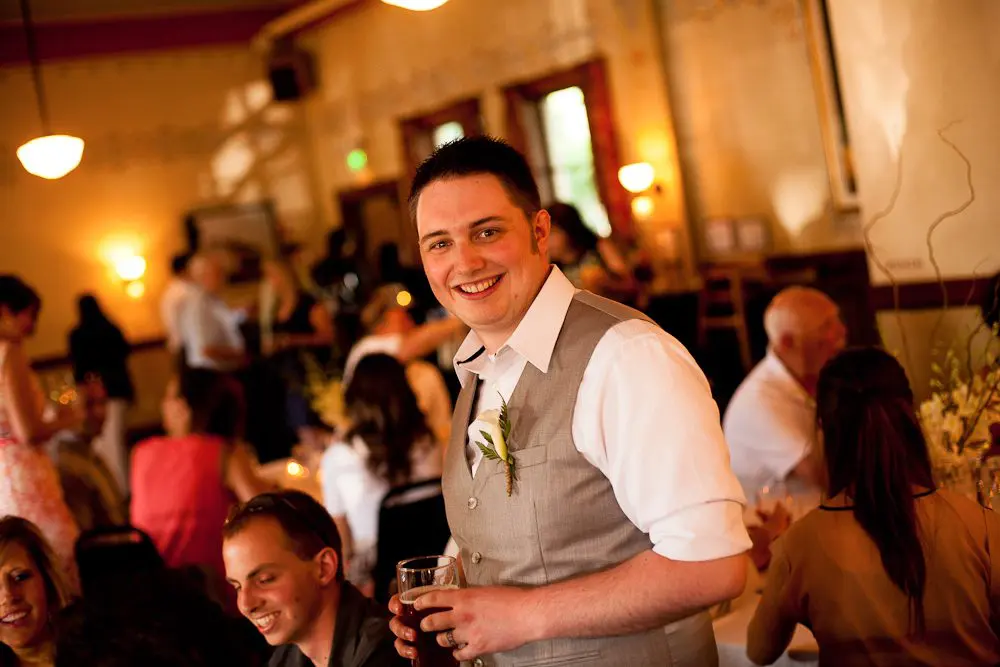 groom at the reception groom having a fun time at the reception