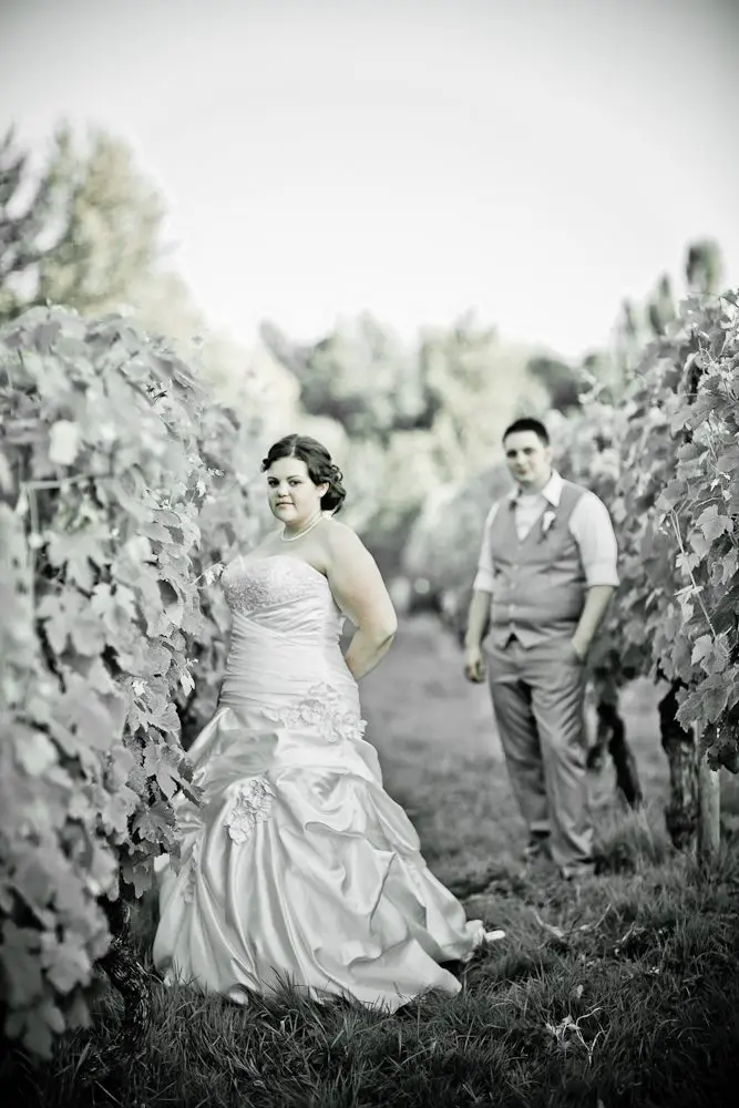 bride and groom formal shot bride with groom out of focus in the background