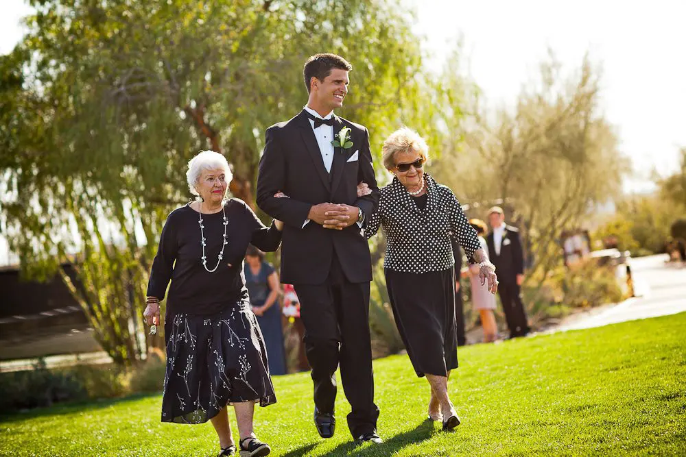 groom with grandmas The groom walks his grandmas down the aisle