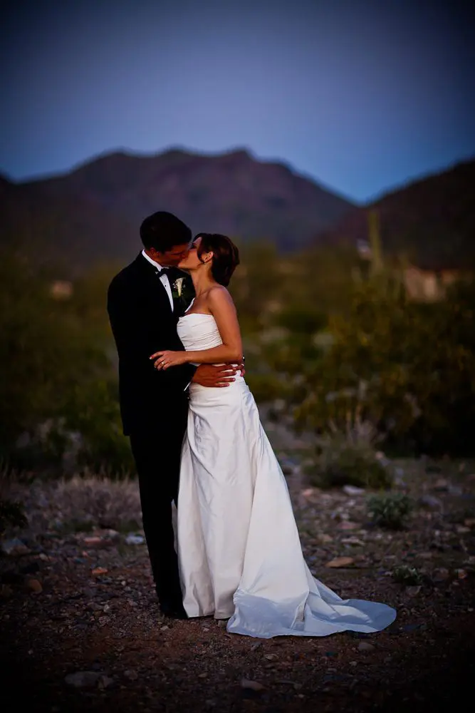full length formal photo bride and groom kissing for a formal photograph