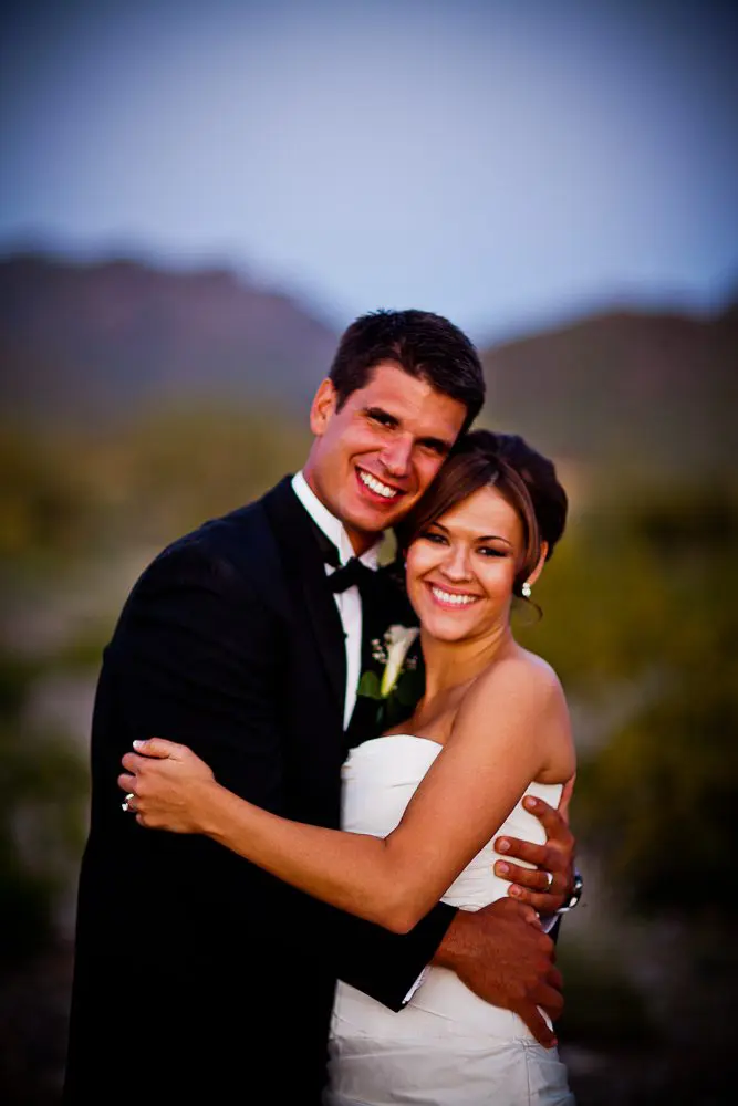 bride and groom smilingq cute couple smiling after being married