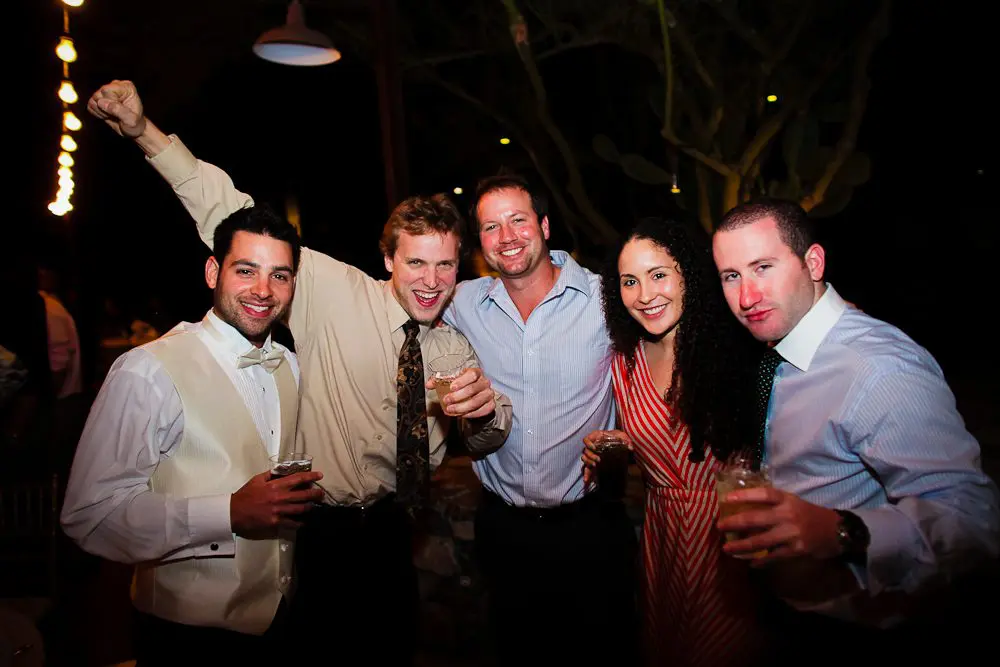 guests having a good time wedding guests enjoying some cocktails at the reception