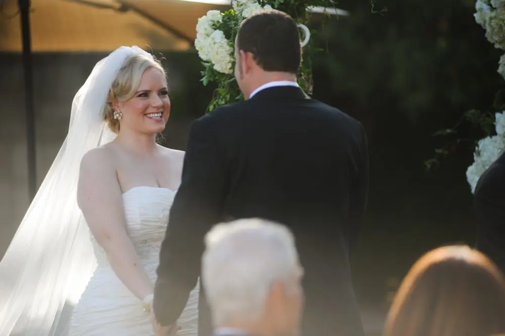 smiling during the ceremony about to tie the knot