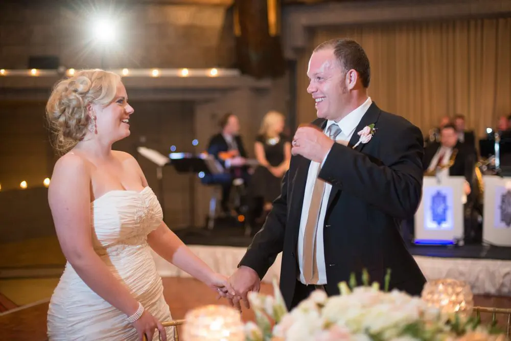 newly married couple during reception bride and groom smiling