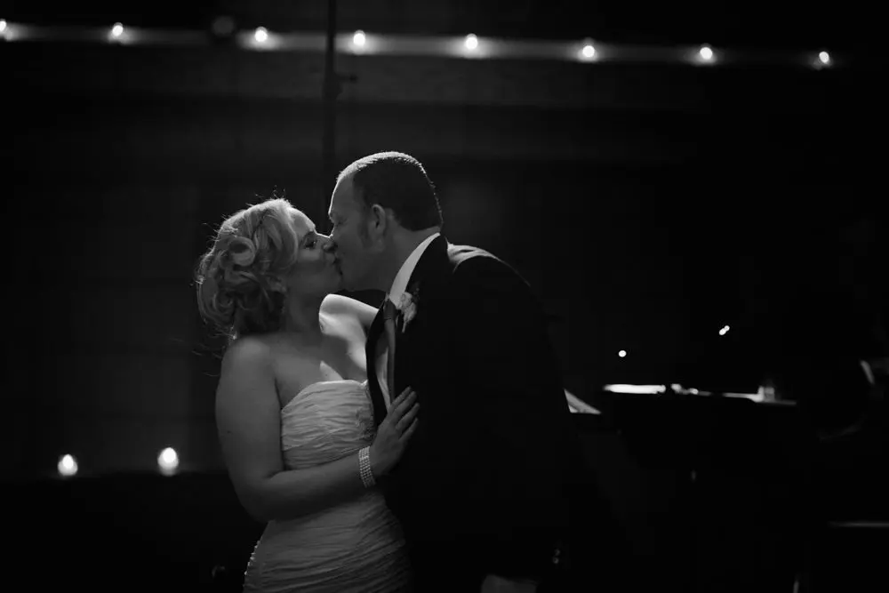 kissing during toasts phoenix wedding photography