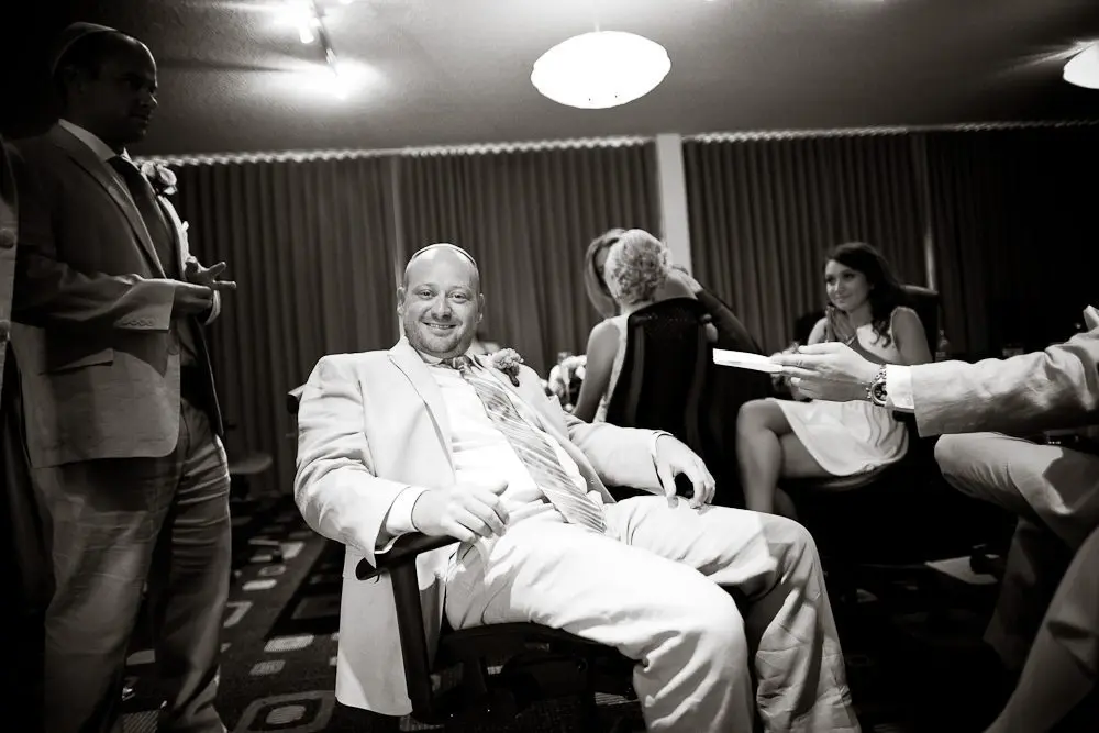 the groom smiling