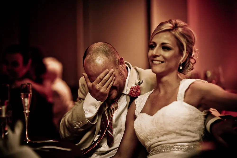 the groom covering his eyes