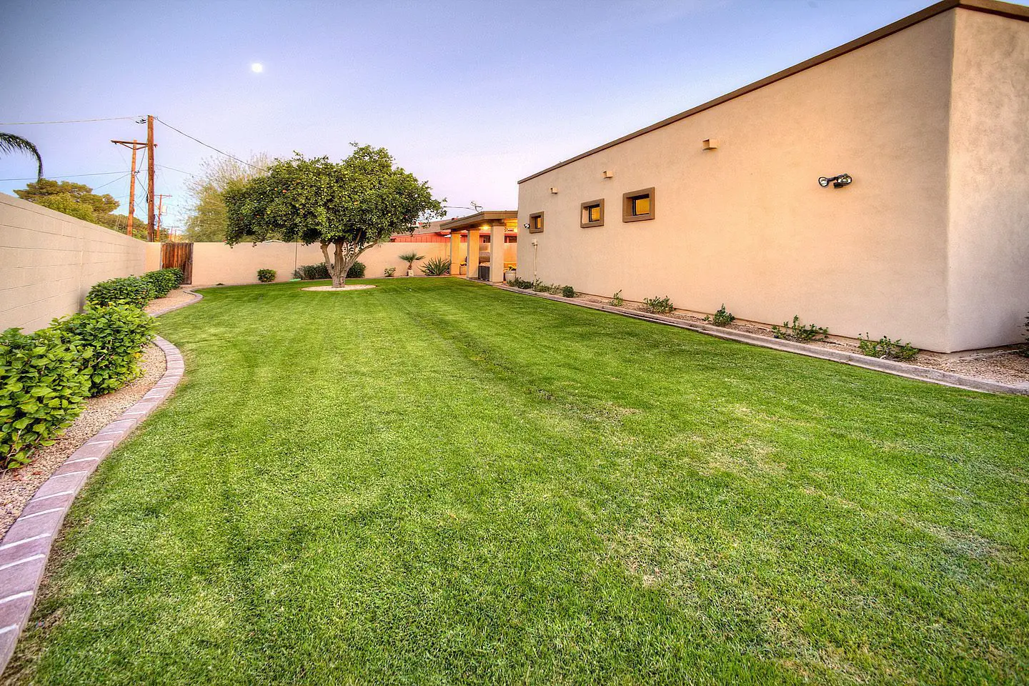 large backyard with moon in shot