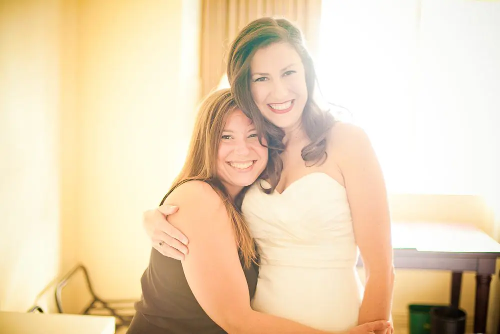the bride with one her best friends while getting ready