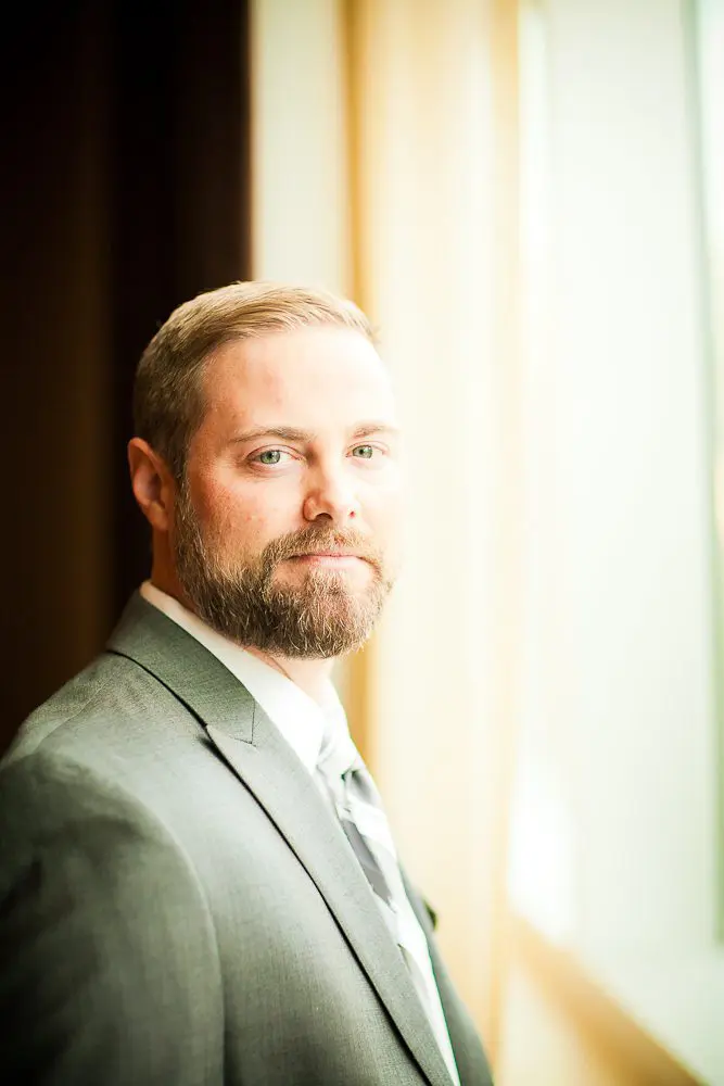 a portrait of the groom while he waits for the first look