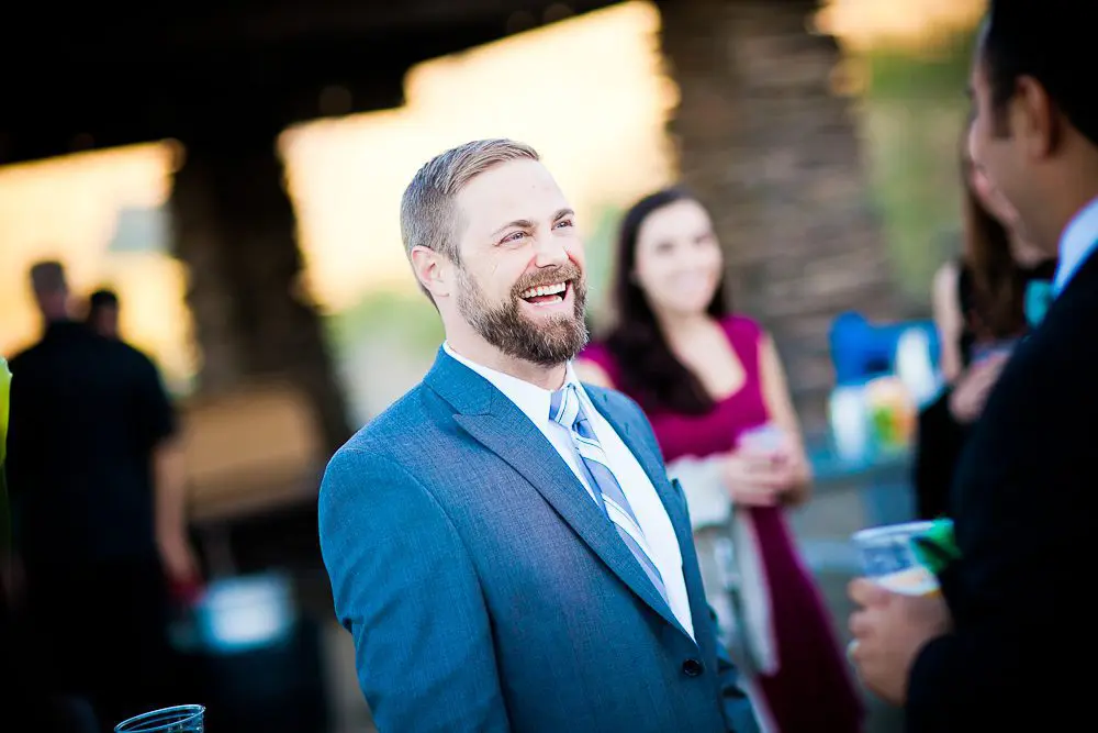 the groom smiling at his wedding
