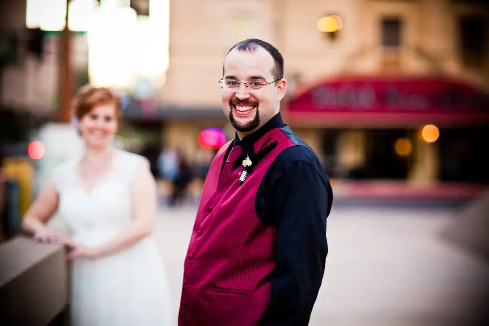 the groom with bride out of focus