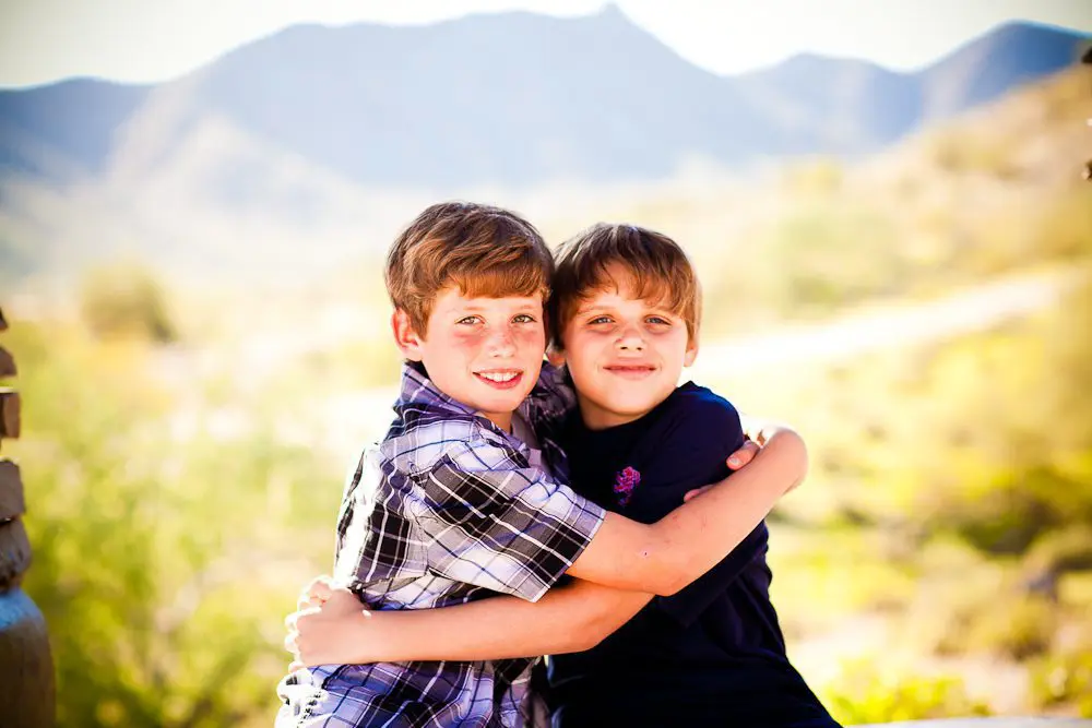 just the boys with the desert in the background