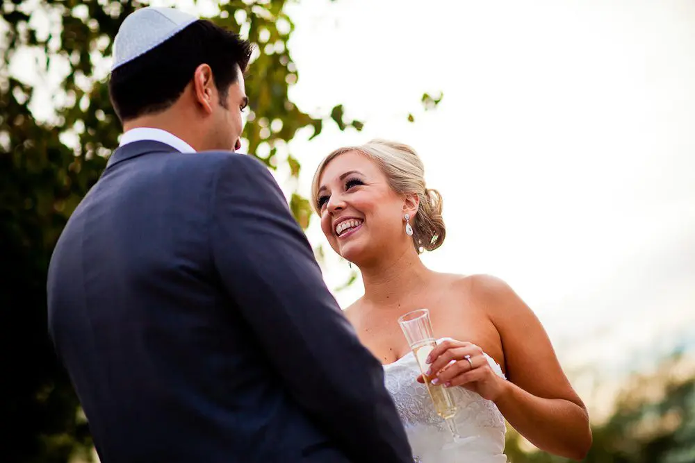 the bride smiling at the groom after the first look