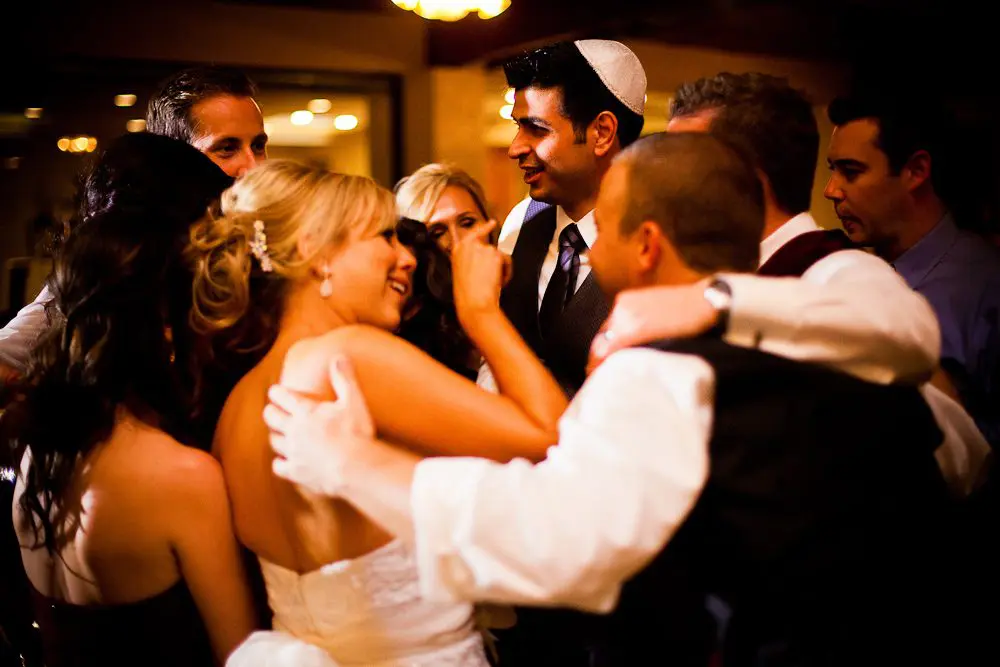 the wedding party having a huddle