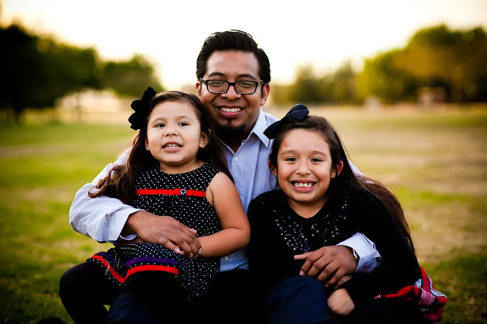 father with his two daughters