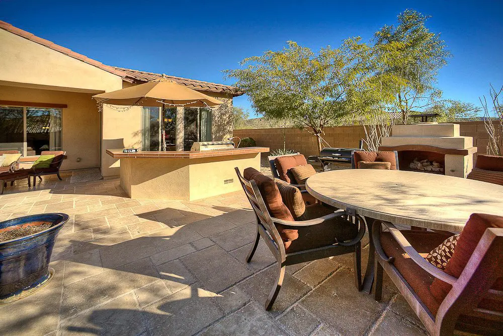 outdoor dining area with bar and grill