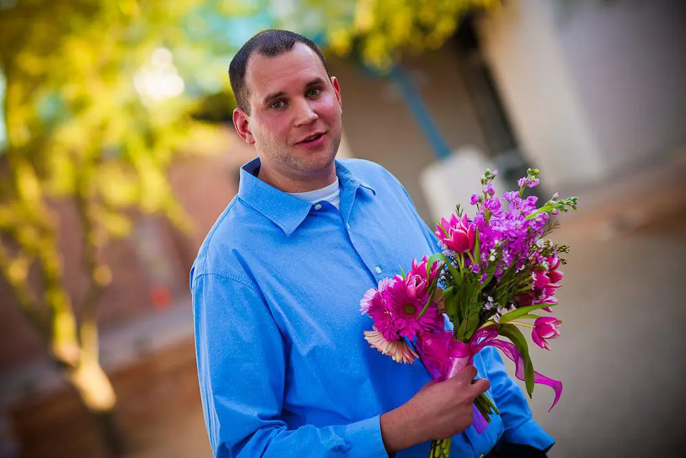 dude stuck holding the flowers