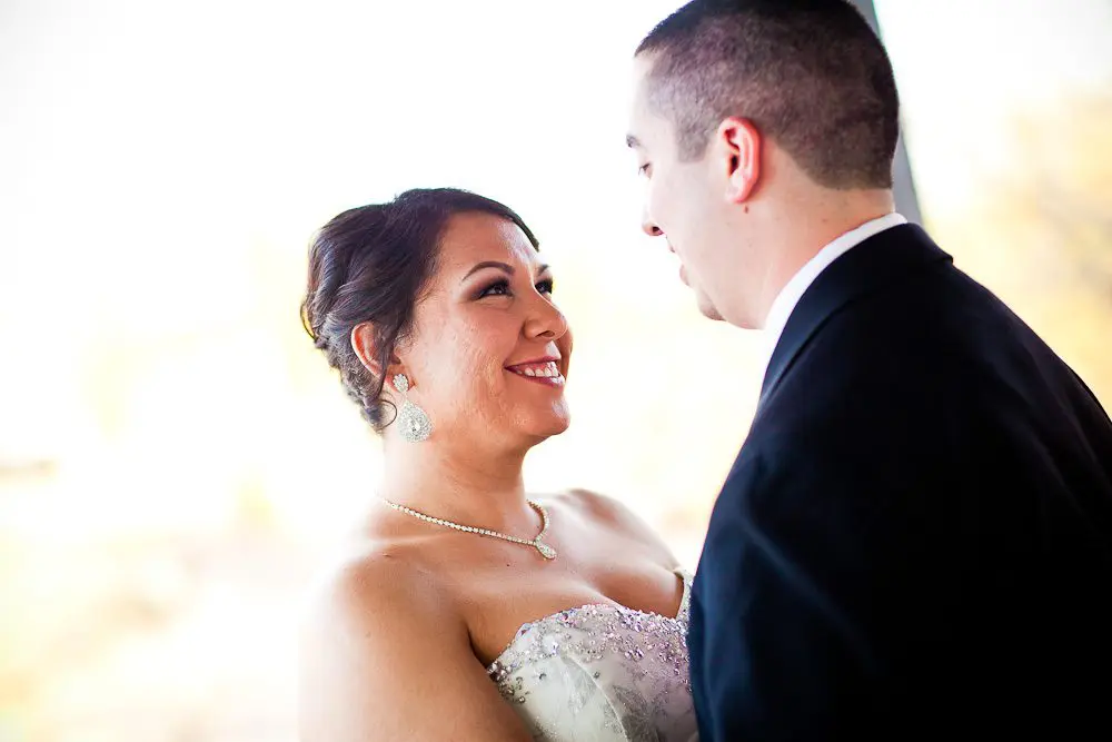 the bride smiling at the groom