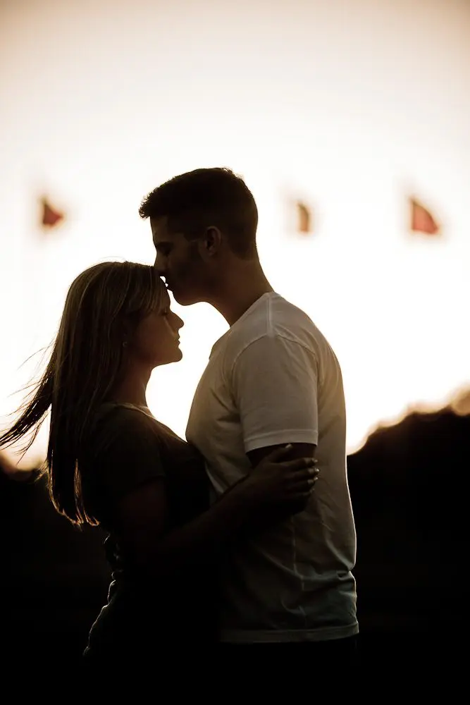 kissing her forehead