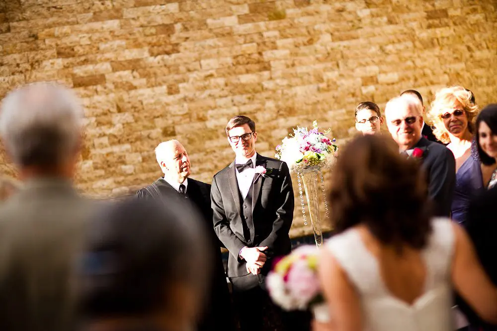 the groom waiting for the bride before walking down the aisle