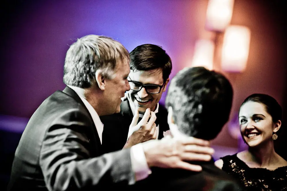 the groom laughing during the wedding