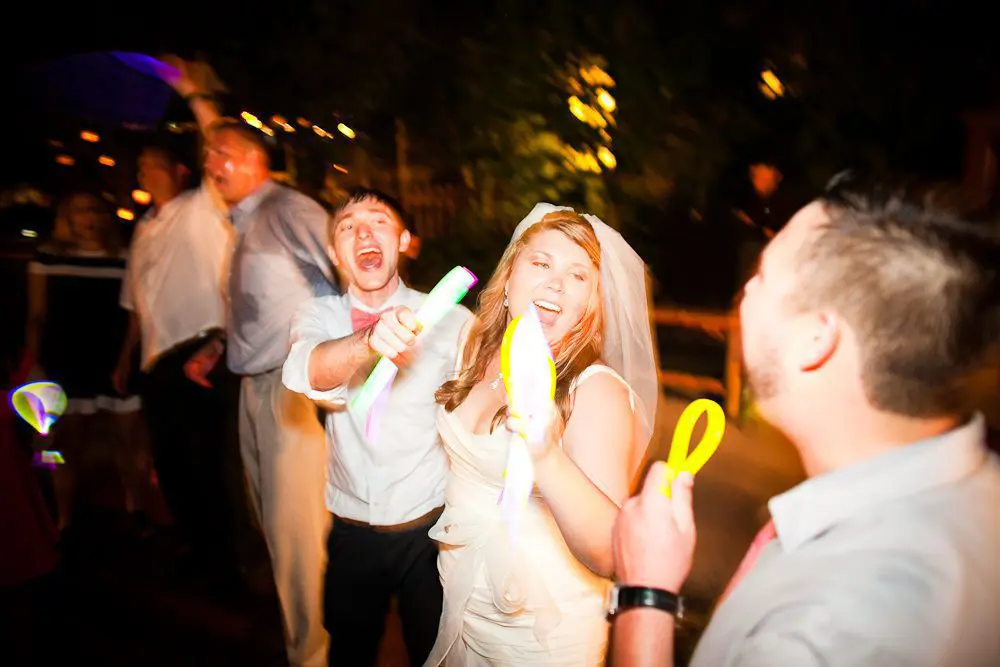 the bride and groom partying at the reception