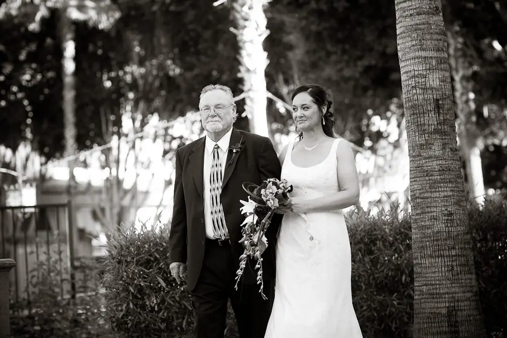 bride walking down aisle with her father