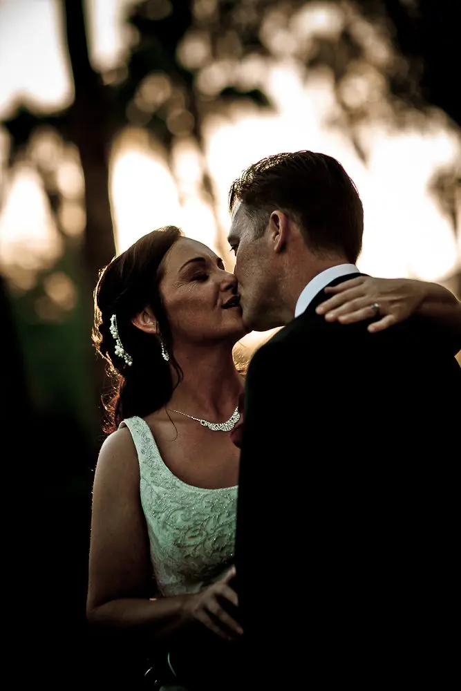 bride and groom kissing