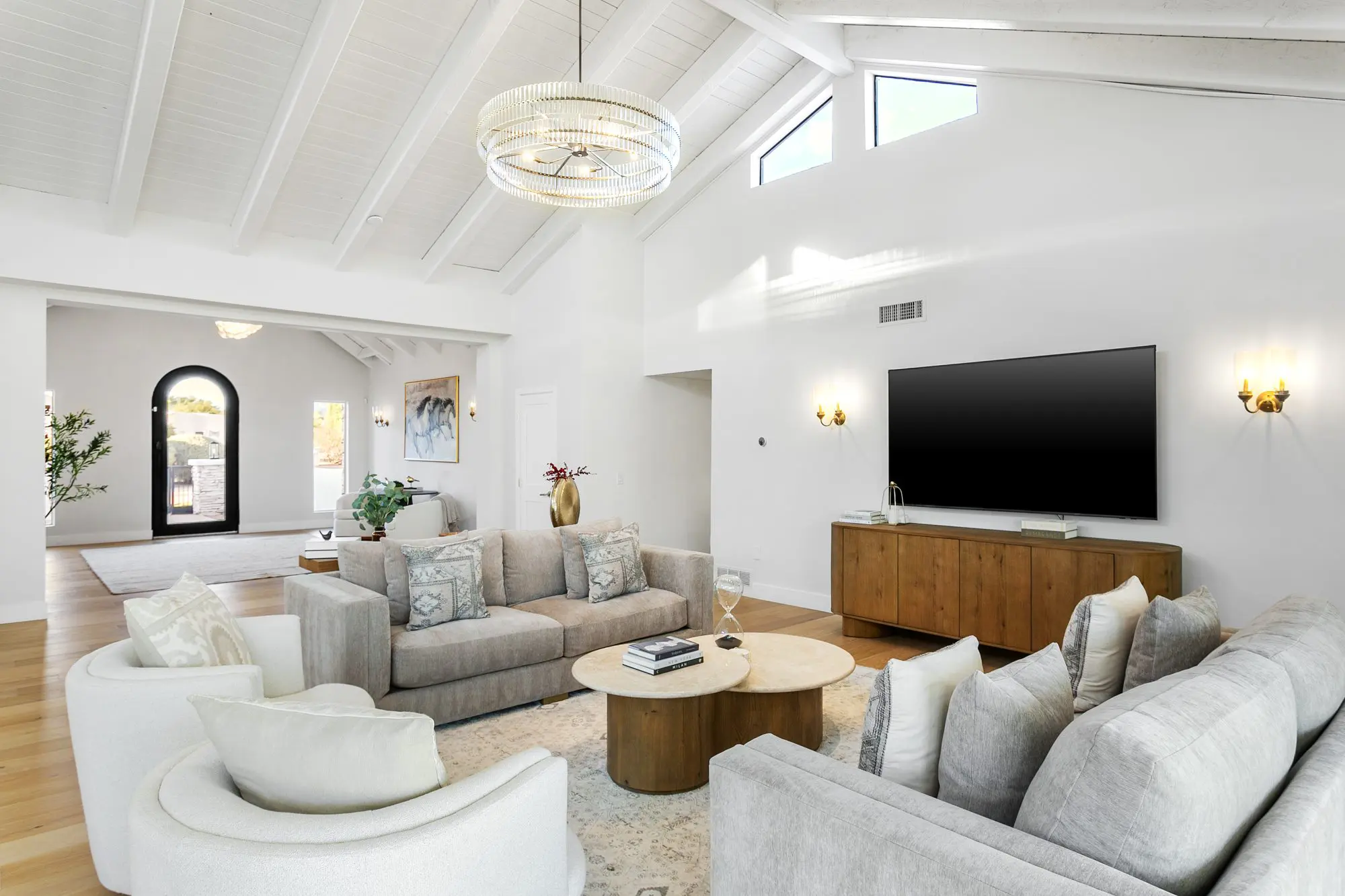 Family room with vaulted ceiling and media wall