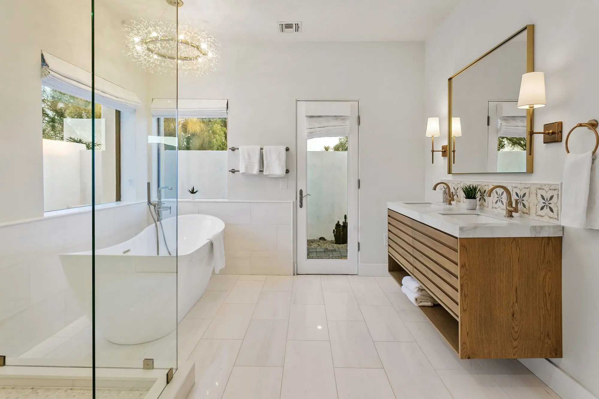 Primary bathroom with freestanding tub and glass shower