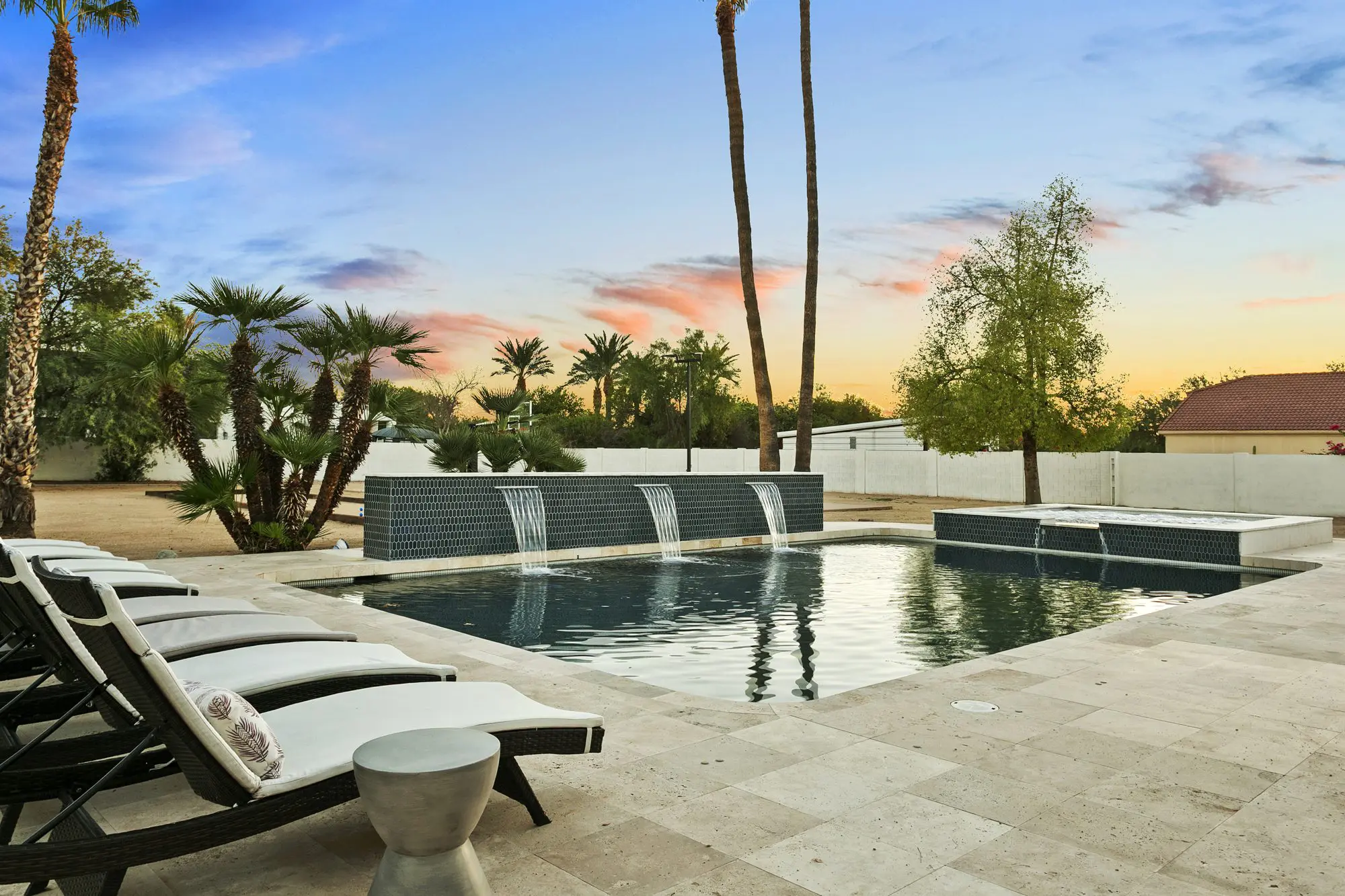Backyard pool and loungers at sunset, Scottsdale