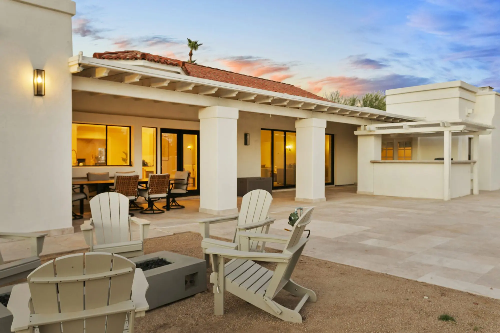 Covered patio and fire pit at twilight