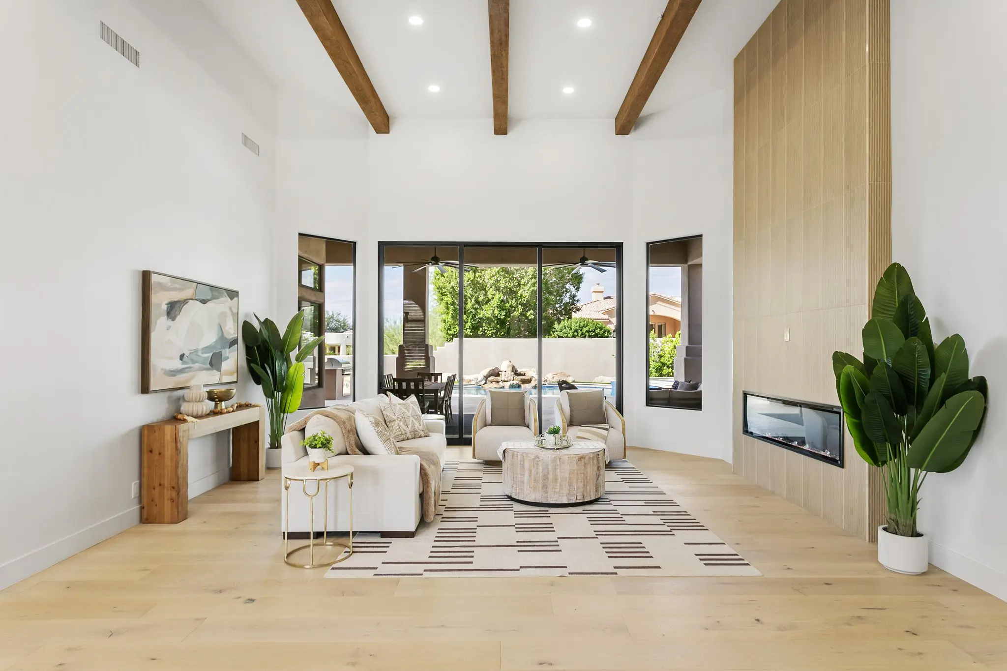 Great room with vaulted beamed ceiling and wall of glass to the pool, Scottsdale real estate photography