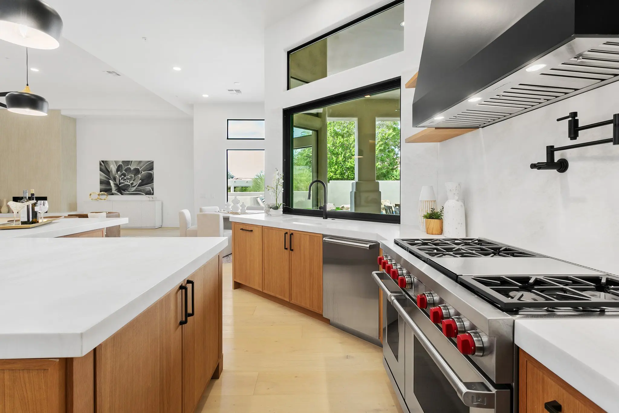 Wolf range, pot filler and pass-through window to the patio