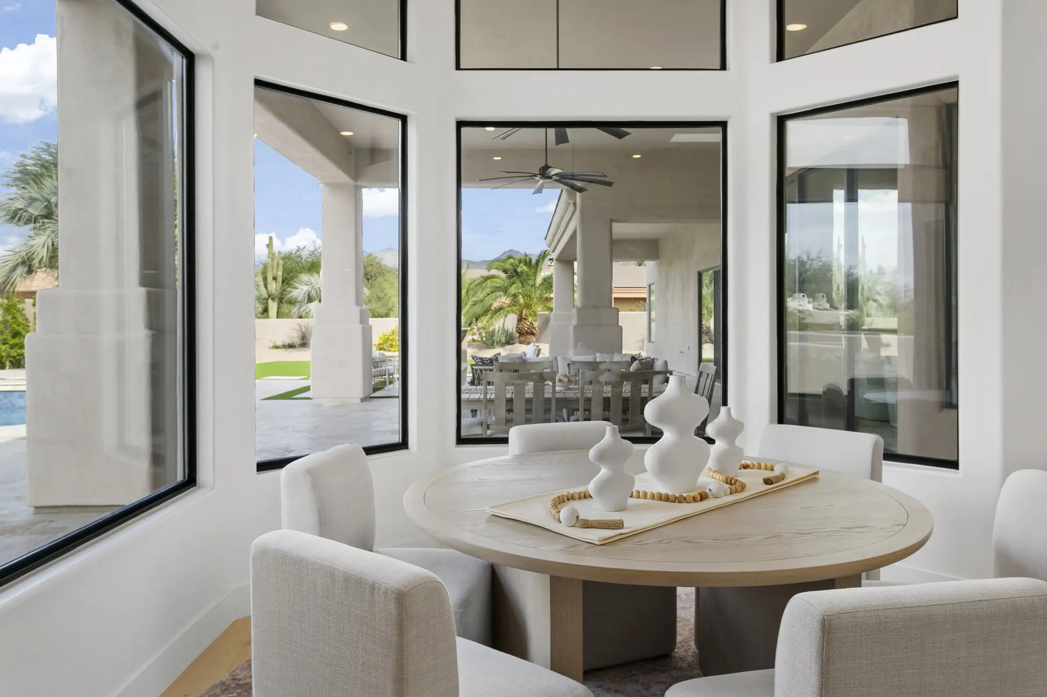 Breakfast nook surrounded by windows overlooking the pool, Scottsdale home