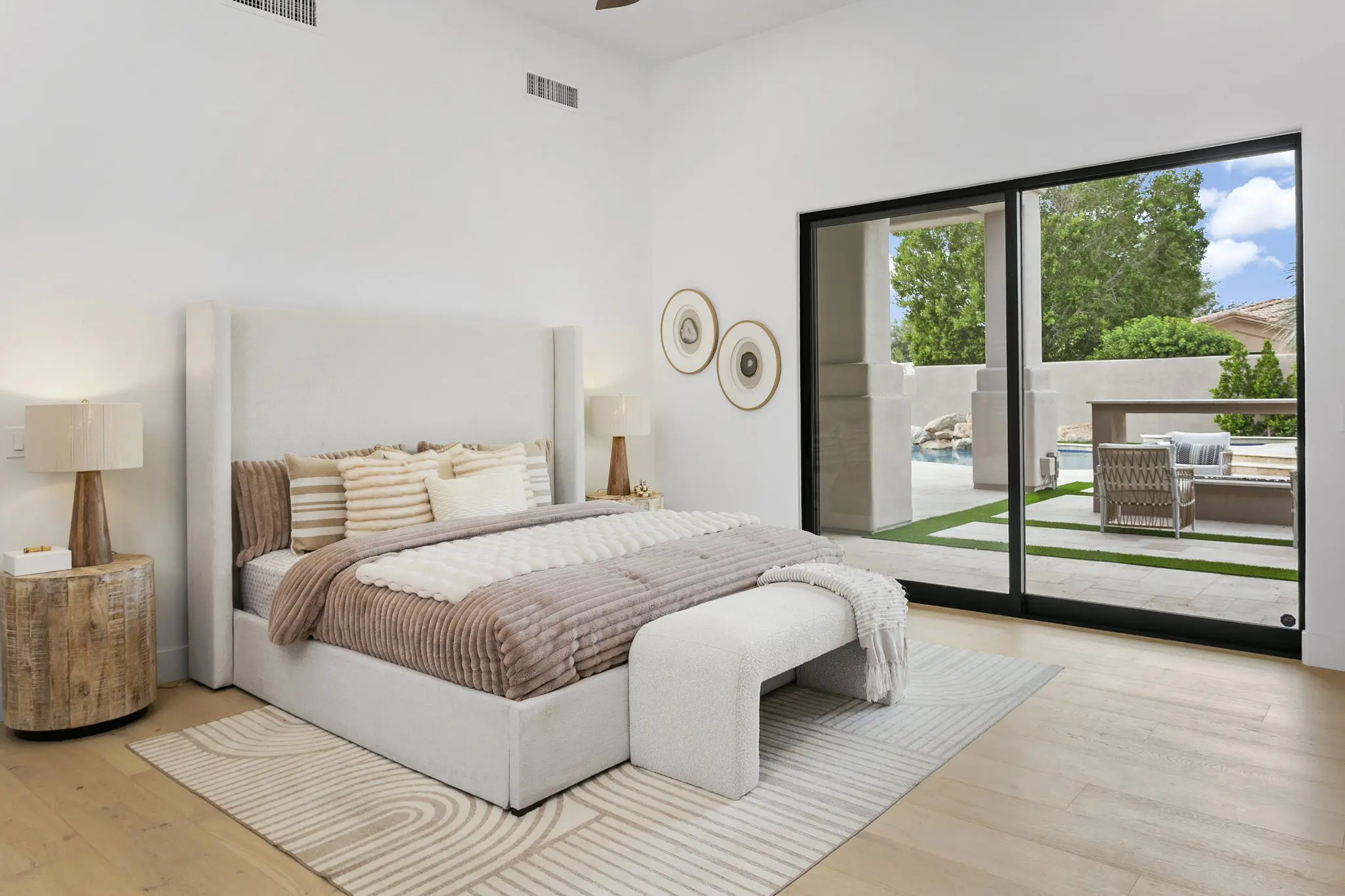 Primary bedroom with sliding glass doors to the backyard, Scottsdale luxury home