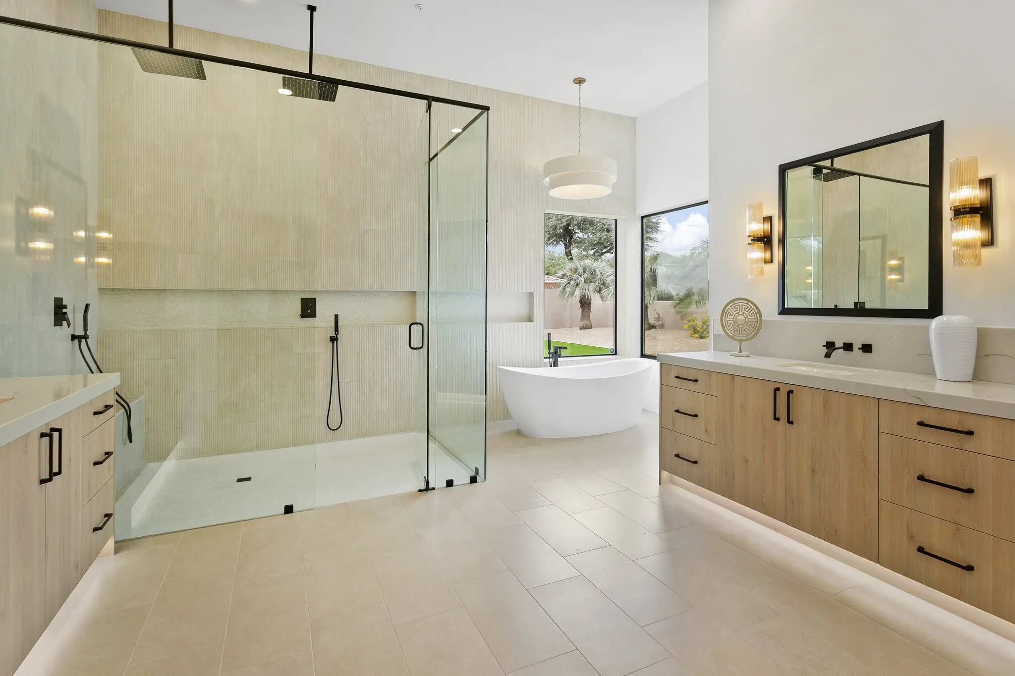 Primary bathroom with glass shower, freestanding tub and double vanity