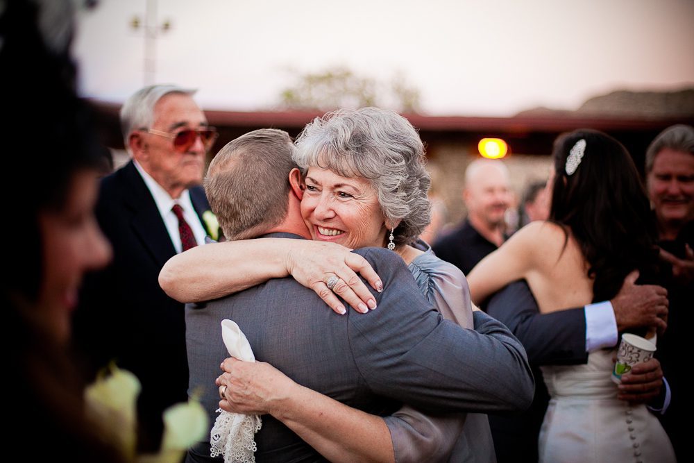 Mother of the bride hugs her new son in law after the ceremony