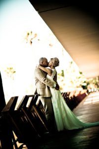 bride and groom kissing before their marriage ceremony