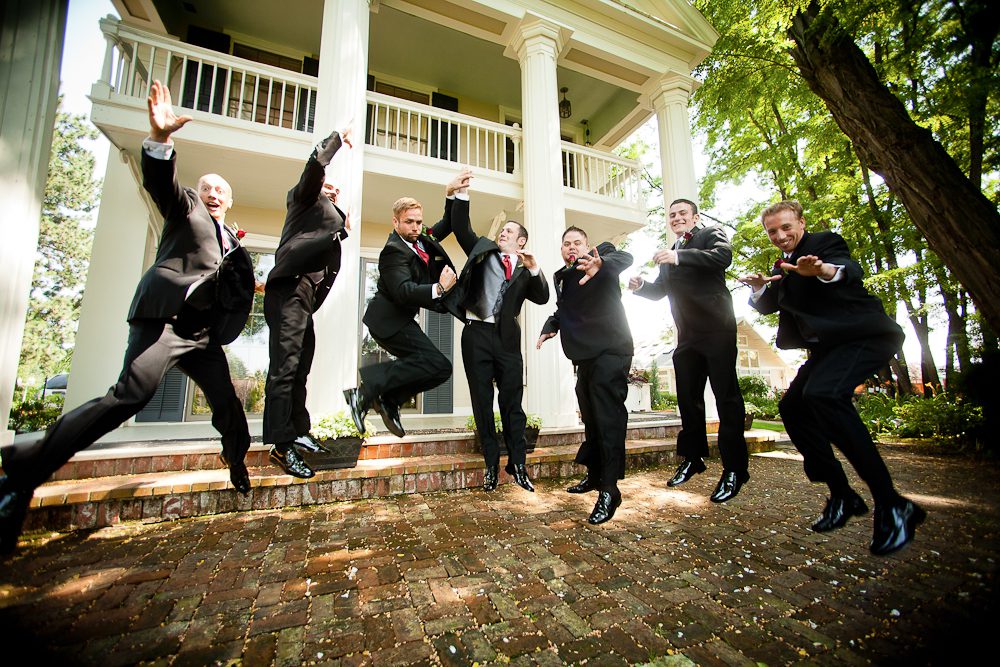 groomsmen jumping during the formals