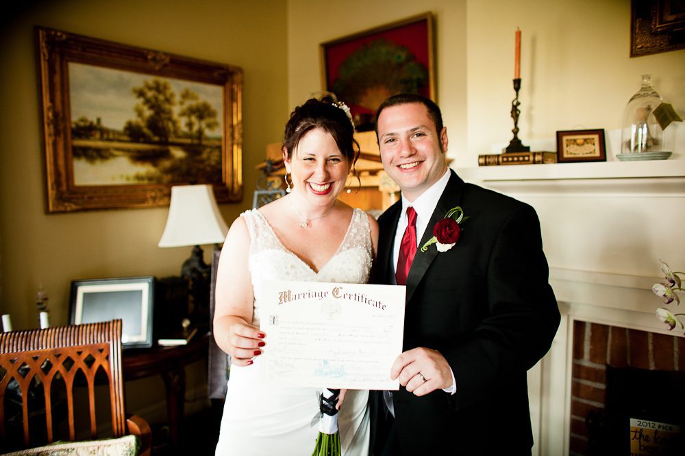 smiling after signing the marriage certificate