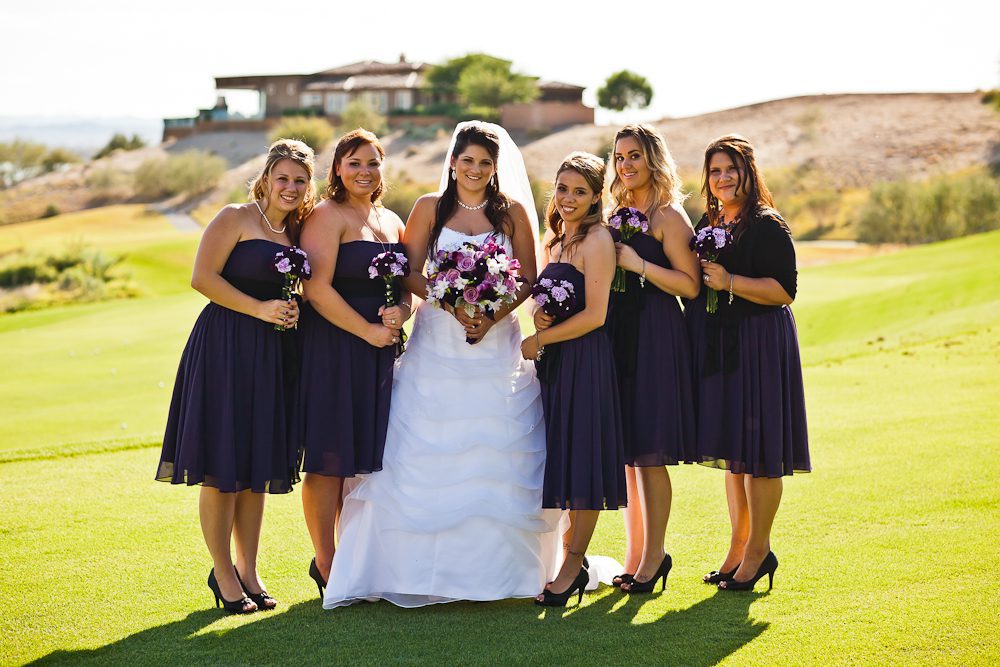 formal shot of bride with bridesmaids on the golf course