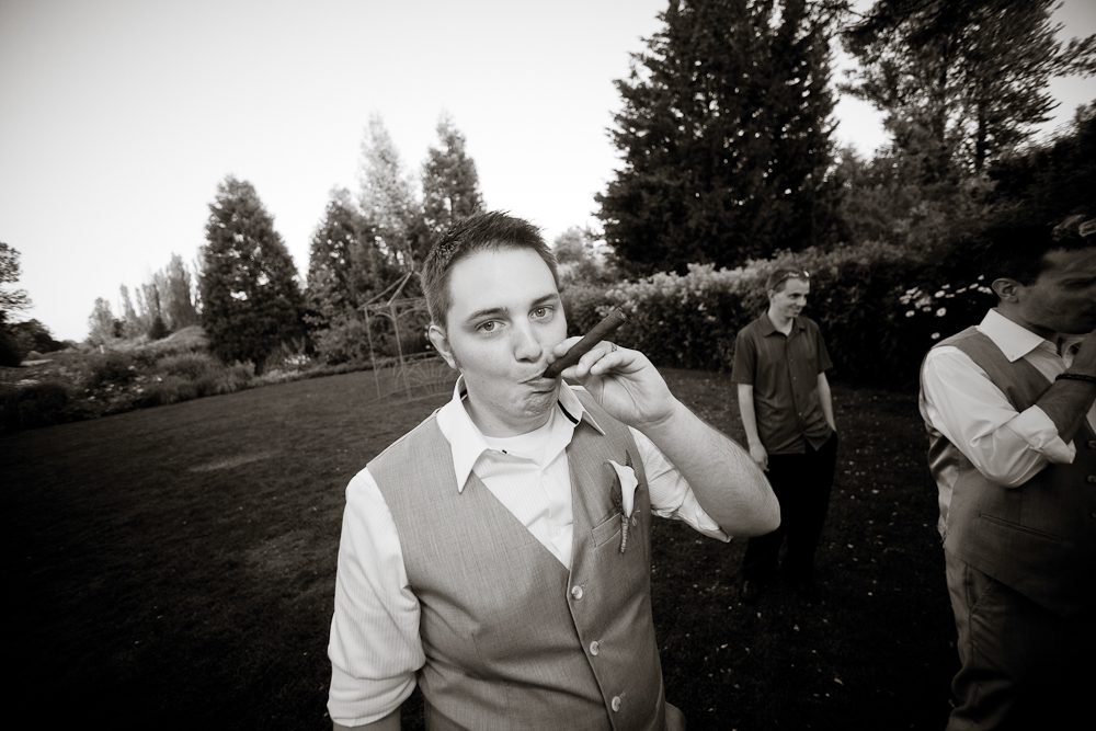 funny picture of groom smoking a cigar