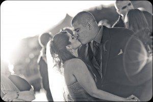 newly married couple kissing on dance during first dance