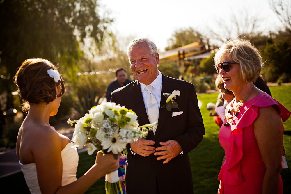 father greeting bride after ceremony