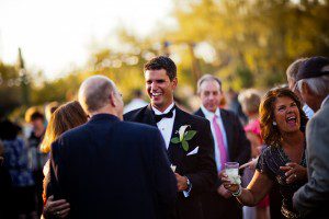 groom being greeted by guests at the reception